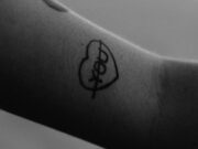 Salate – सलते black tattoo on persons arm