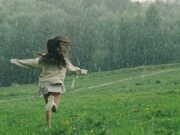 Bhaav Attarache – भाव अत्तराचे A Person Running in a Grass Field While Raining