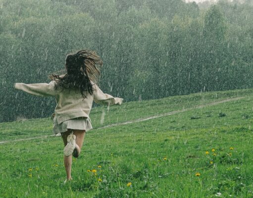 Bhaav Attarache – भाव अत्तराचे A Person Running in a Grass Field While Raining