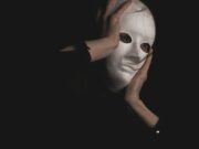 You Are Just Playing A Role person in black long sleeve shirt covering face with face