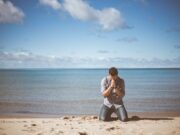 Emotional Complexity man kneeling down near shore