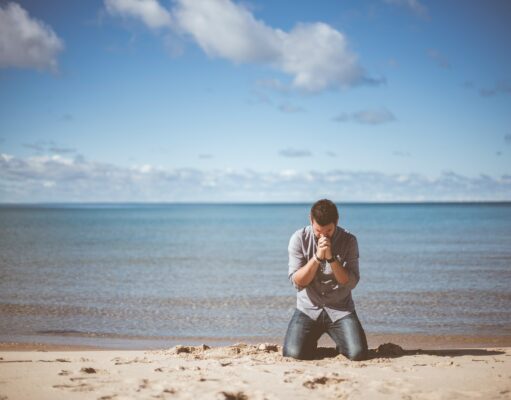 Emotional Complexity man kneeling down near shore