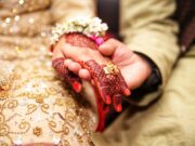 Lagna Mhanaje – लग्न म्हणजे person holding hands wearing gold-colored ring