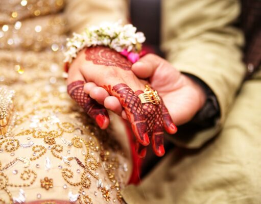 Lagna Mhanaje – लग्न म्हणजे person holding hands wearing gold-colored ring
