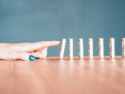 Sequence person holding white and blue plastic blocks