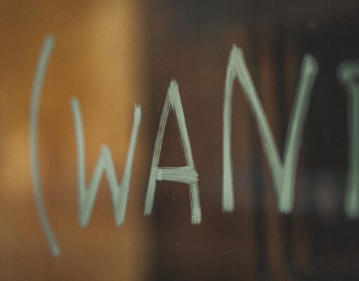 Wants – इच्छा white letters on brown wooden table