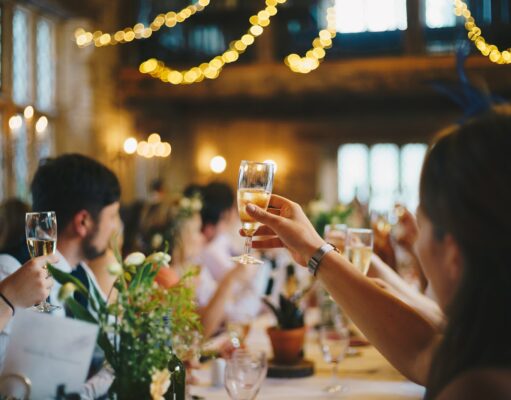 Party Culture Good or Bad? people raising wine glass in selective focus photography